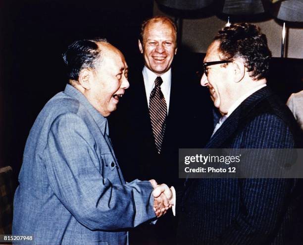 Copy of President Ford Secretary of State Henry Kissinger with Mao Tse-Tung; Chairman of Chinese Communist Party, during a visit to the Chairman's...