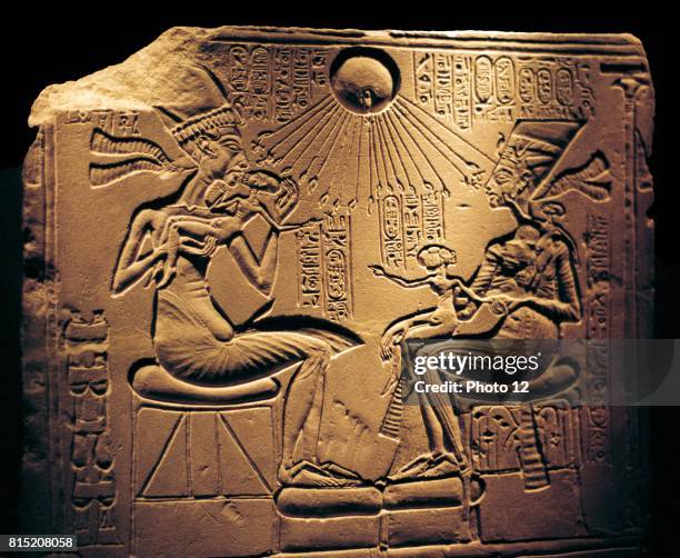 Relief showing Nefertiti, Great Royal Wife and the Egyptian Pharaoh Akhenaten, and their children, with Aten, the sun's disc which they worshipped.