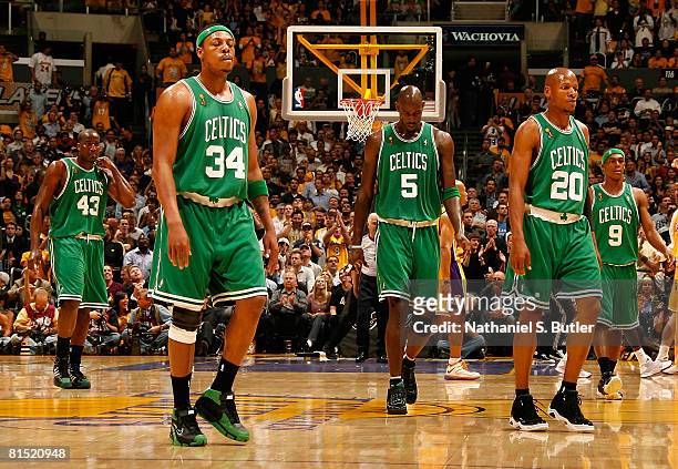 Kendrick Perkins, Paul Pierce, Kevin Garnett, Ray Allen and Rajon Rondo of the Boston Celtics walk towards the bench during a timeout against the Los...