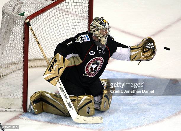 John Curry of the Wilkes-Barre/Scranton Penguins makes a glove save against the Chicago Wolves during the Calder Cup Finals on June 10, 2008 at the...
