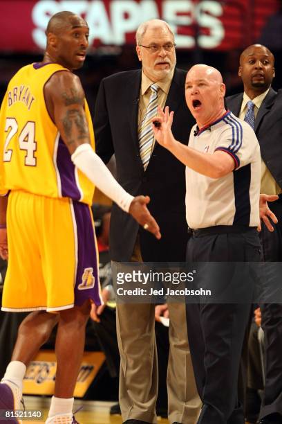 Head coach Phil Jackson and Kobe Bryant of the Los Angeles Lakers argue a call with referee Joe Crawford while taking on the Boston Celtics in Game...