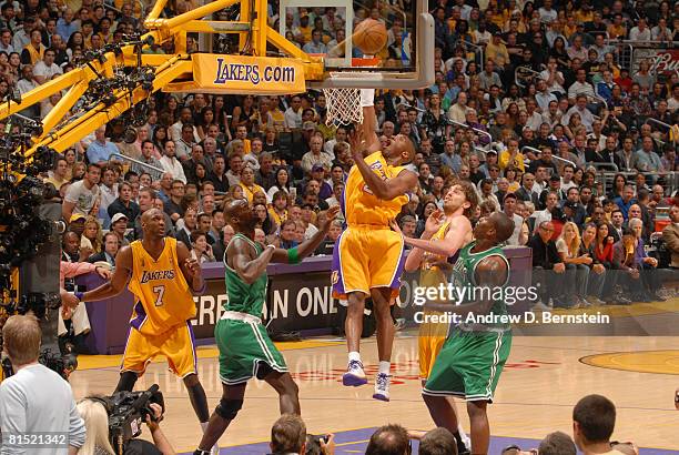 Kobe Bryant of the Los Angeles Lakers goes up for a dunk against Kevin Garnett and Kendrick Perkins of the Boston Celtics in Game Three of the 2008...