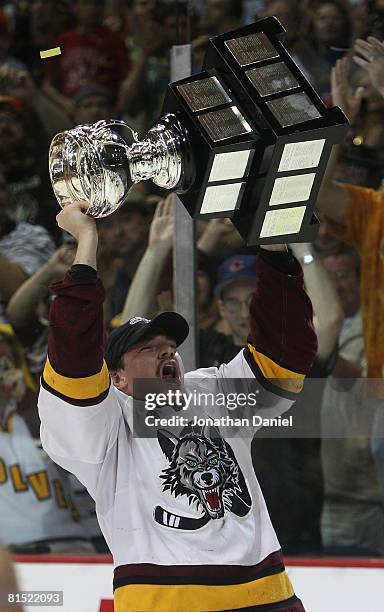 Kevin Doell of the Chicago Wolves celebrates with the Calder Cup trophy following a championship win over the Wilkes-Barre/Scranton Penguins during...