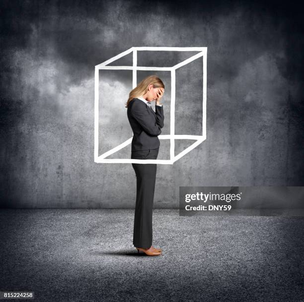 woman feeling boxed in - financial fear stock pictures, royalty-free photos & images