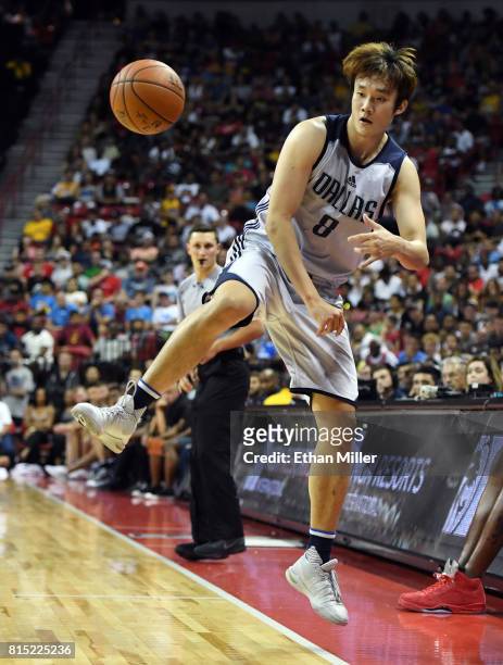 Ding Yanyuhang of the Dallas Mavericks saves the ball from going out of bounds during a 2017 Summer League game against the Boston Celtics at the...