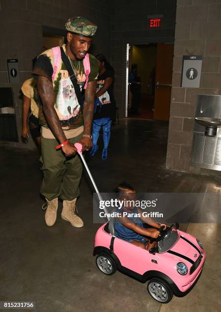 Player Iman Shumpert with daughter Iman Tayla 'Junie' Shumpert Jr. At 2017 V-103 Care & Bike Show at Georgia World Congress Center on July 15, 2017...