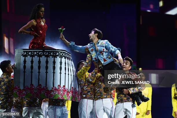 Bollywood actor Varun Dhawan performs on stage during the 18th International Indian Film Academy Festival at the MetLife Stadium in East Rutherford,...