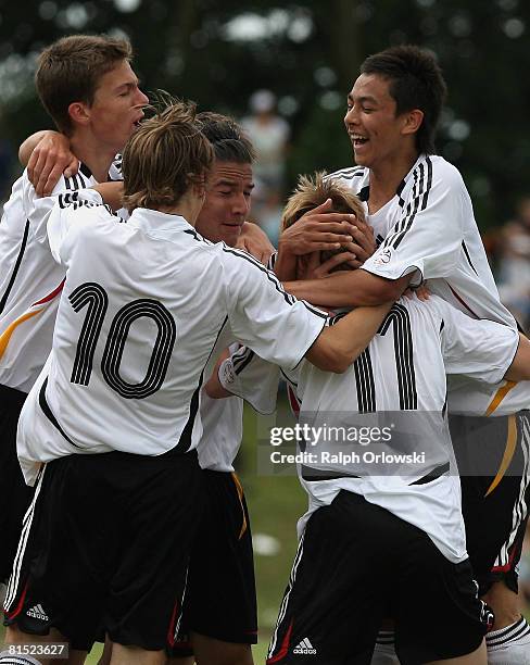 Players of Germany show their delight after Jannis Ackermann scored against Popland during their friendly match between the Geman Under 15 national...