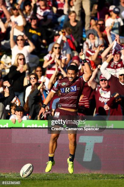 Matthew Wright of the Sea Eagles celebrates scoring a try during the round 19 NRL match between the Manly Sea Eagles and the Wests Tigers at...