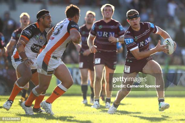 Thomas Trbojevic of the Sea Eagles runs the ball during the round 19 NRL match between the Manly Sea Eagles and the Wests Tigers at Lottoland on July...