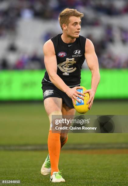 Ciaran Byrne of the Blues kicks during the round 17 AFL match between the Carlton Blues and the Western Bulldogs at Melbourne Cricket Ground on July...
