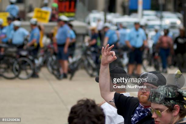 Trump supporter is seen making a gesture on the sidelines of an Anti-Trump Refuse Racism rally in Center City Philadelphia, Pennsylvania, on July 15,...