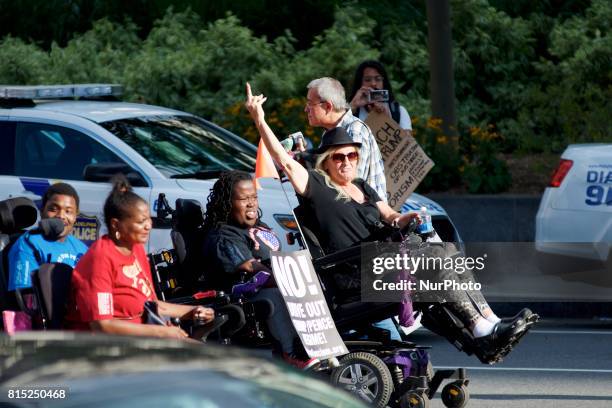 Protestors in wheelchairs lead a Refuse Racism march in Philadelphia, Pennsylvania, on July 15, 2017.