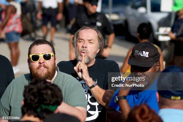 Anti-Trump protestors participating in a Refuse Racism rally interact with a small group of pro-Trump supporters in Philadelphia, Pennsylvania, on...