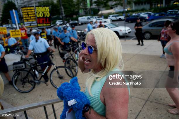 Michael Hisey, dressed up as Kellyanne Conway, takes part in an anti-Trump Refuse Racism rally in Philadelphia, Pennsylvania, on July 15, 2017.