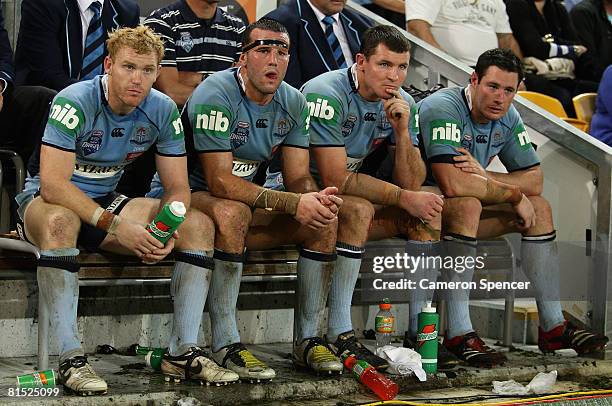 Blues players look dejected on the bench during match two of the ARL State of Origin series between the Queensland Maroons and the New South Wales...