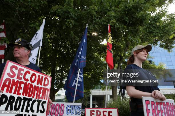 Kaitlyn House, right, a pro gun supporter from Greenland, MD., holds a sign in front of the National Rifle Association headquarters in Fairfax, Va.,...