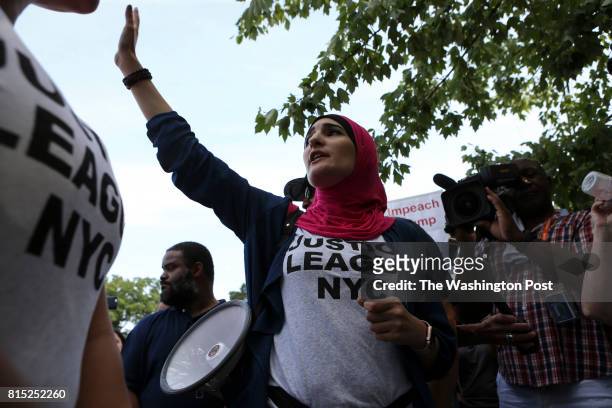 Lynda Sosur, a Women's March organizer, speaks in front of the National Rifle Association headquarters in Fairfax, Va., during a rally organized by...