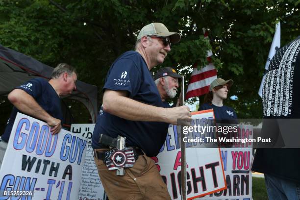Pro gun owners make their voices heard in front of the National Rifle Association headquarters in Fairfax, Va., during a rally organized by Womens...