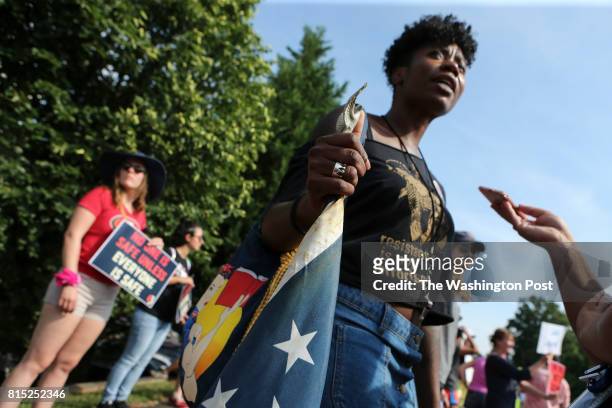 Tamara Lee, from Manhattan, NY protests in front of the National Rifle Association headquarters in Fairfax, Va., during a rally organized by Womens...
