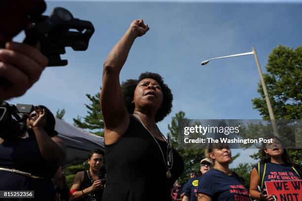 Woman protests in front of the National Rifle Association headquarters in Fairfax, Va., during a rally organized by Womens March to denounce the NRAs...
