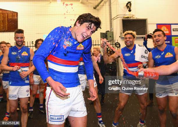 Lewis Young of the Bulldogs is sprayed with drinks after winning the round 17 AFL match between the Carlton Blues and the Western Bulldogs at...