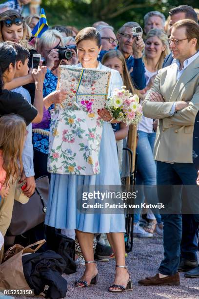 Crown Princess Victoria of Sweden is seen meeting the people gathered in front of Solliden Palace to celebrate the 40th birthday of Crown Princess...