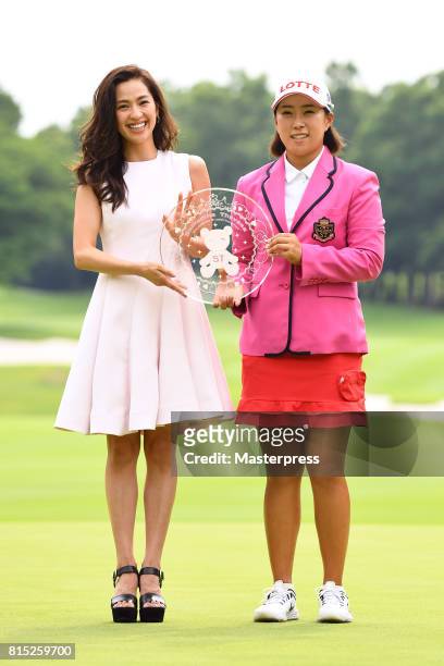 Anne Nakamura of Japan and Hae-Rym Kim of South Korea pose with the trophy after winning the Samantha Thavasa Girls Collection Ladies Tournament at...