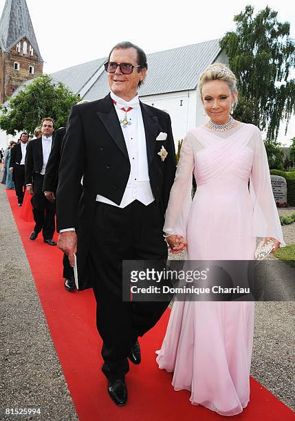 Christina 'Kiki' Tholstrup and Roger Moore arrive to attend the wedding between Prince Joachim of Denmark and Marie Cavallier on May 24, 2008 at the...