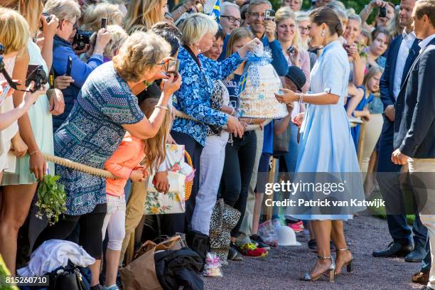 Crown Princess Victoria of Sweden is seen meeting the people gathered in front of Solliden Palace to celebrate the 40th birthday of Crown Princess...