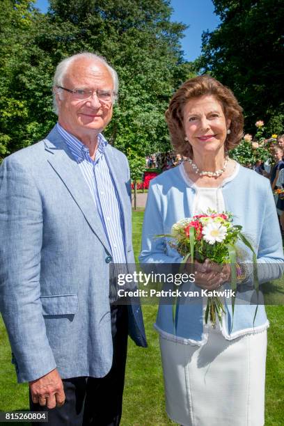 King Carl Gustaf of Sweden and Queen Silvia of Sweden is seen meeting the people gathered in front of Solliden Palace to celebrate the 40th birthday...