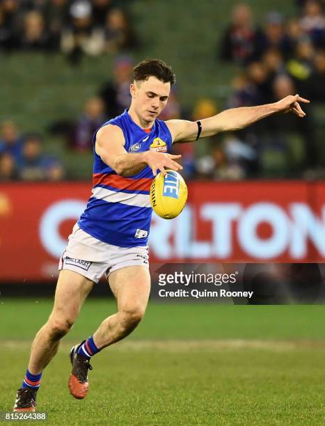 Toby McLean of the Bulldogs kicks during the round 17 AFL match between the Carlton Blues and the Western Bulldogs at Melbourne Cricket Ground on...