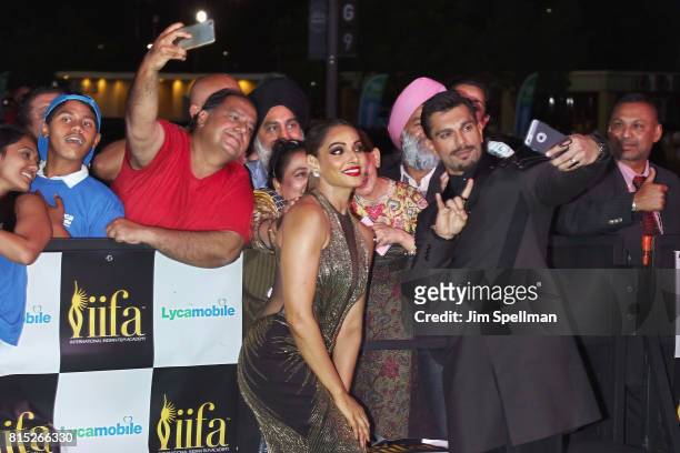 Actors Bipasha Basu and Karan Singh Grover pose with the fans attend the 2017 International Indian Film Academy Festival at MetLife Stadium on July...