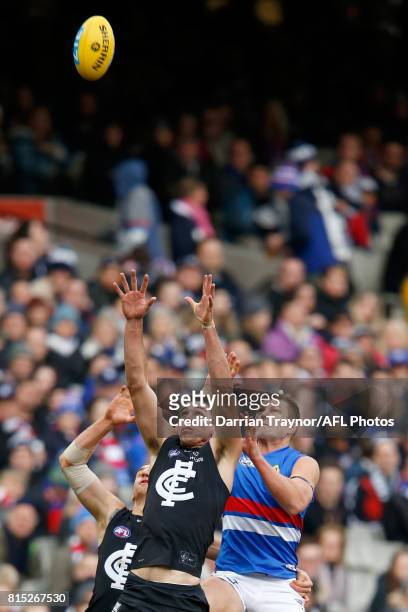 Matthew Kreuzer of the Blues and Jack Redpath of the Bulldogs compete for the ball during the round 17 AFL match between the Carlton Blues and the...