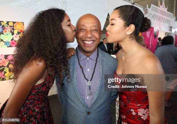 Founder, RUSH Philanthropic Arts Foundation Russell Simmons and daughters Ming Lee Simmons and Aoki Lee Simmons attend "Midnight At The Oasis" Annual...
