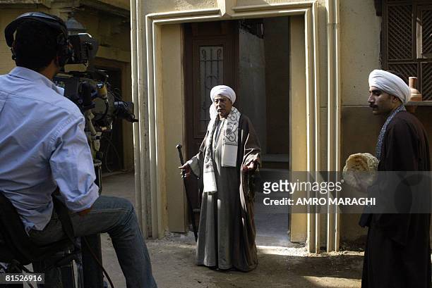 Veteran Egyptian actor Salah al-Saadani acts during a shooting session May 27, 2006 at Cairo's Al-Ahram studios of the new TV series "Haret...