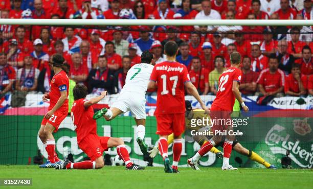 Cristiano Ronaldo of Portugal shoots and scores his teams second goal during the UEFA EURO 2008 Group A match between Czech Republic and Portugal at...