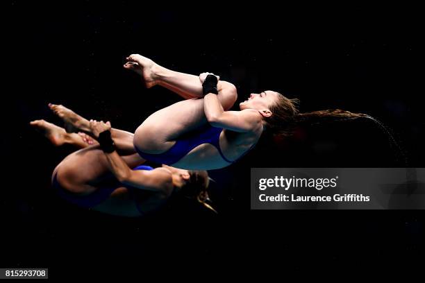 Tonia Couch and Lois Toulson of Great Britain compete during the Women's Diving 10M Synchro Platform, preliminary round on day three of the Budapest...