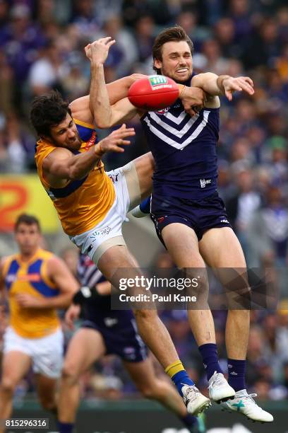 Josh Kennedy of the Eagles and Joel Hamling of the Dockers contest a mark during the round 17 AFL match between the Fremantle Dockers and the West...