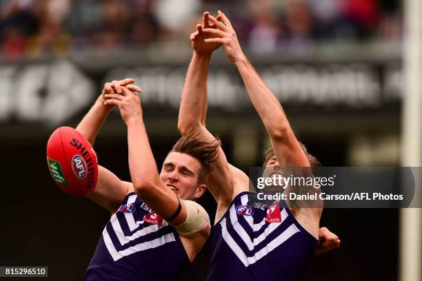 Ryan Nyhuis of the Dockers competes for a mark with teammate Joel Hamling of the Dockers during the 2017 AFL round 17 match between the Fremantle...