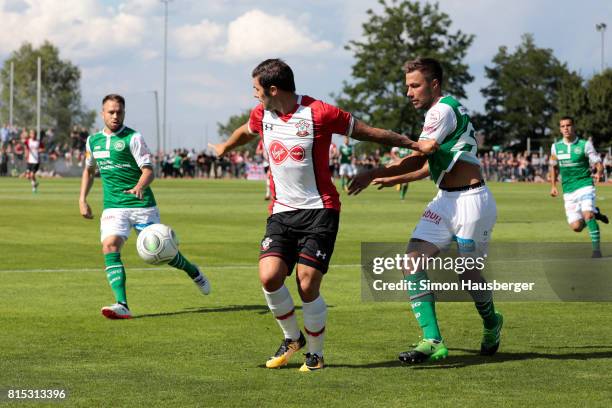 Charlie Austin from FC Southampton and Alain Wiss from St. Gallen in action during the pre-season friendly match between FC Southampton and St....