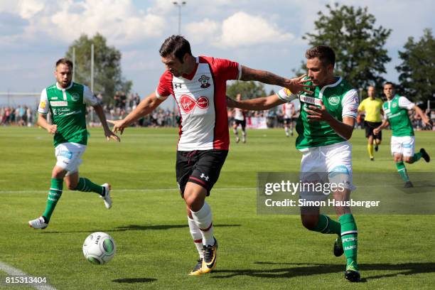 Charlie Austin from FC Southampton and Alain Wiss from St. Gallen in action during the pre-season friendly match between FC Southampton and St....
