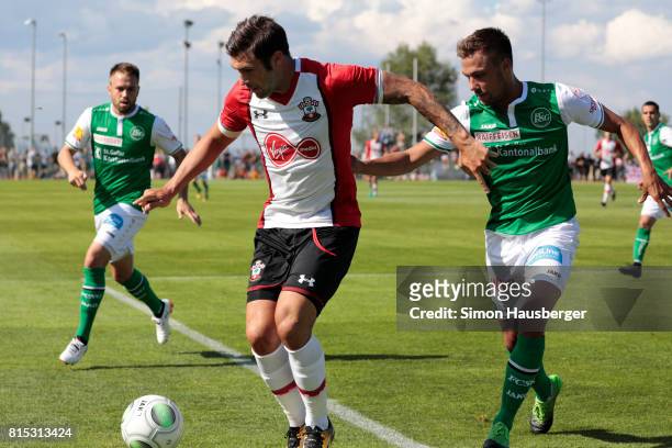 Charlie Austin from FC Southampton and Alain Wiss from St. Gallen in action during the pre-season friendly match between FC Southampton and St....