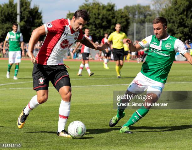 Charlie Austin from FC Southampton and Alain Wiss from St. Gallen in action during the pre-season friendly match between FC Southampton and St....