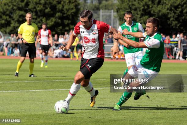 Charlie Austin from FC Southampton and Alain Wiss from St. Gallen in action during the pre-season friendly match between FC Southampton and St....