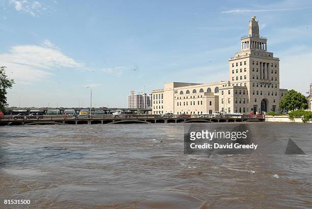 The Federal Building stands on an island next to the rising Cedar River June 11, 2008 in Cedar Rapids, Iowa. Several areas of the city have already...