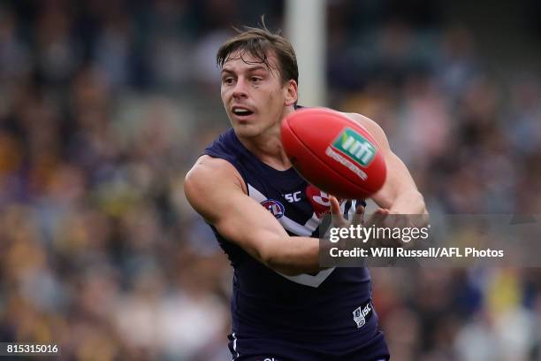 Nick Suban of the Dockers handpasses the ball during the round 17 AFL match between the Fremantle Dockers and the West Coast Eagles at Domain Stadium...