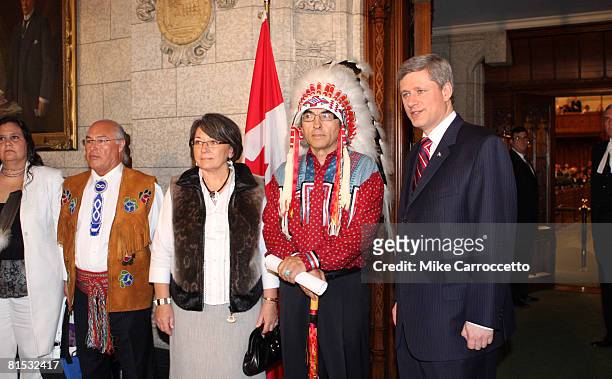 Canadian Prime Minister Stephen Harper and National Chief of the Assembly of First Nations Phil Fontaine pause before walking into the House of...