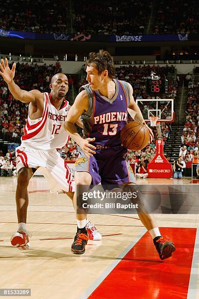 Steve Nash of the Phoenix Suns drives the ball against Rafer Alston of the Houston Rockets during the game on April 11, 2008 at the Toyota Center in...