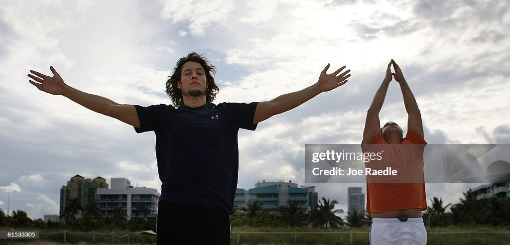 Floridians Relieve Stress With Yoga On The Beach